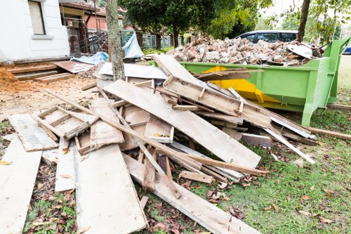 Professional garden clearance team at work in West London