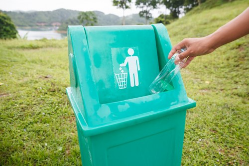 Waste collection workers handling rubbish in West London